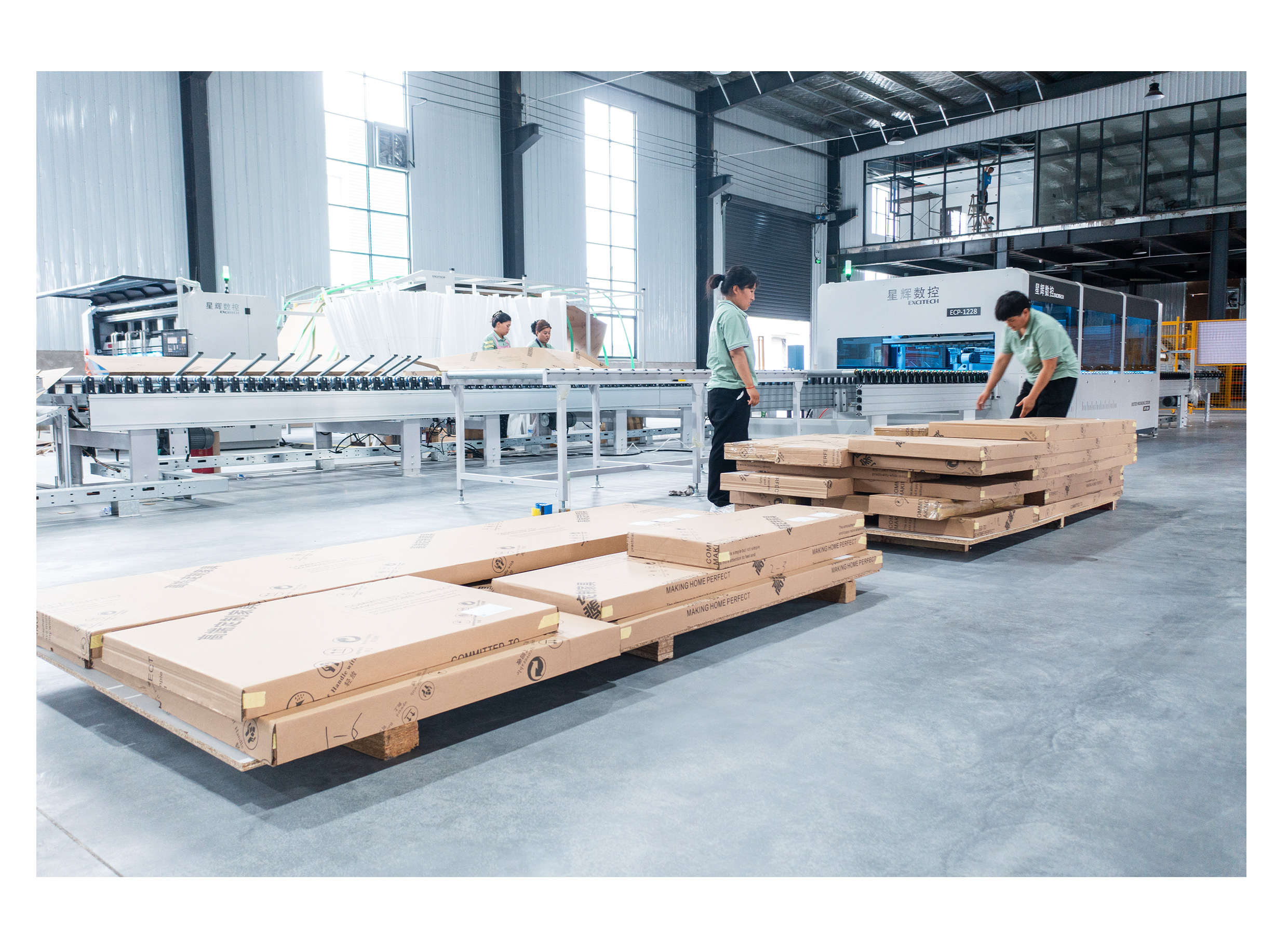Operators preparing products on an Excitech packaging line